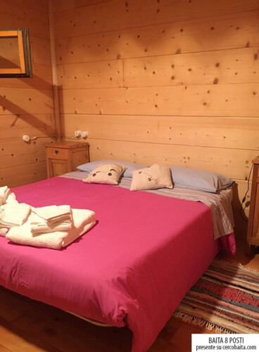 stanza da letto matrimoniale baita San Martino di Castrozza