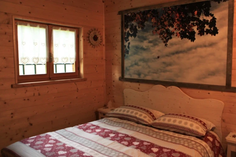 camera da letto nella baita Tana da lOrs